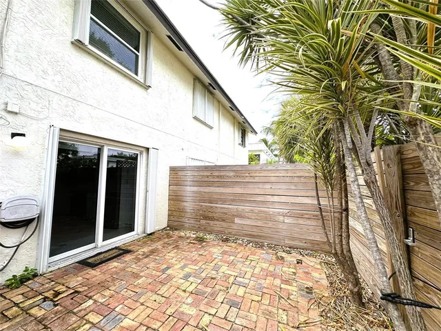 a view of a pathway both side of house