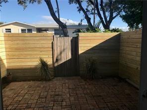 1917 Northeast 3rd Street, Unit 113 Deerfield Beach, FL 33441 - Photo 22 of 23 a view of a back yard of the house