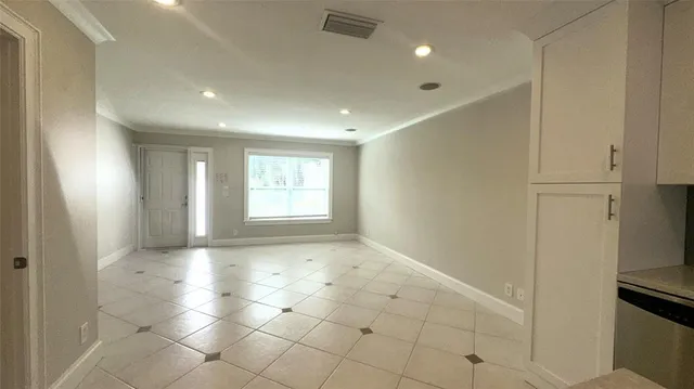 a kitchen with stainless steel appliances kitchen island a refrigerator sink and stove