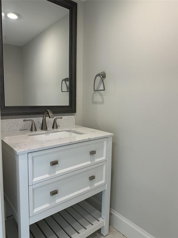 1917 Northeast 3rd Street, Unit 113 Deerfield Beach, FL 33441 - Photo 8 of 23 a bathroom with a sink and a mirror