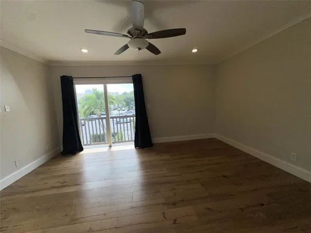 a view of a balcony with wooden floor and outdoor space
