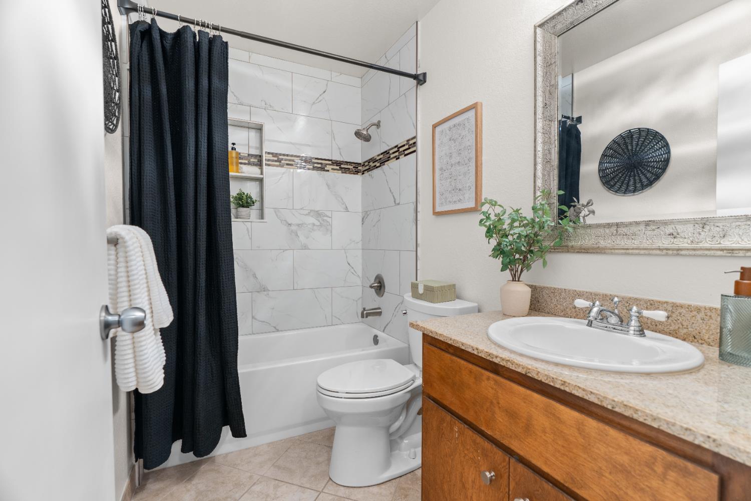 2401 Eilers Lane, Unit 105 Lodi, CA 95242 - Photo 14 of 23 a bathroom with a granite countertop sink toilet a mirror and shower