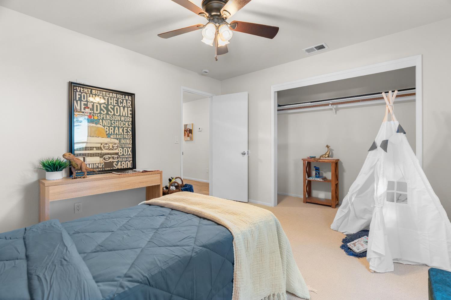 2401 Eilers Lane, Unit 105 Lodi, CA 95242 - Photo 16 of 23 a bedroom with a bed and a chandelier