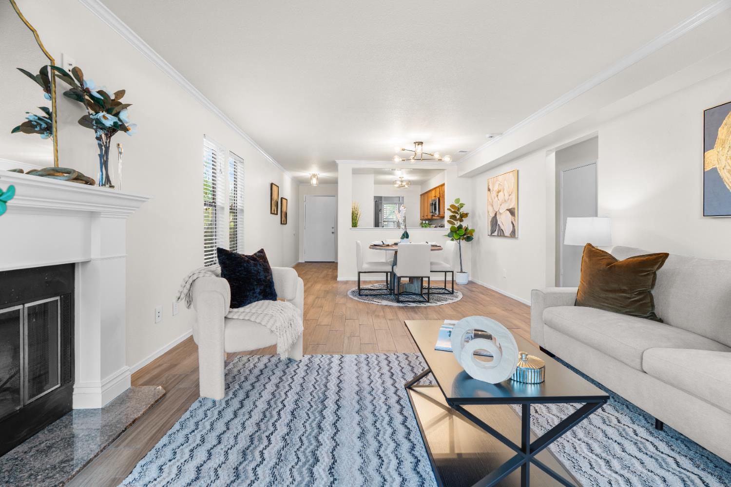 2401 Eilers Lane, Unit 105 Lodi, CA 95242 - Photo 18 of 23 a living room with furniture a fireplace and a potted plant