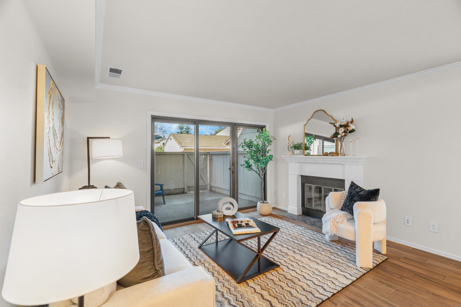 2401 Eilers Lane, Unit 105 Lodi, CA 95242 - Photo 4 of 23 a living room with furniture and a fireplace