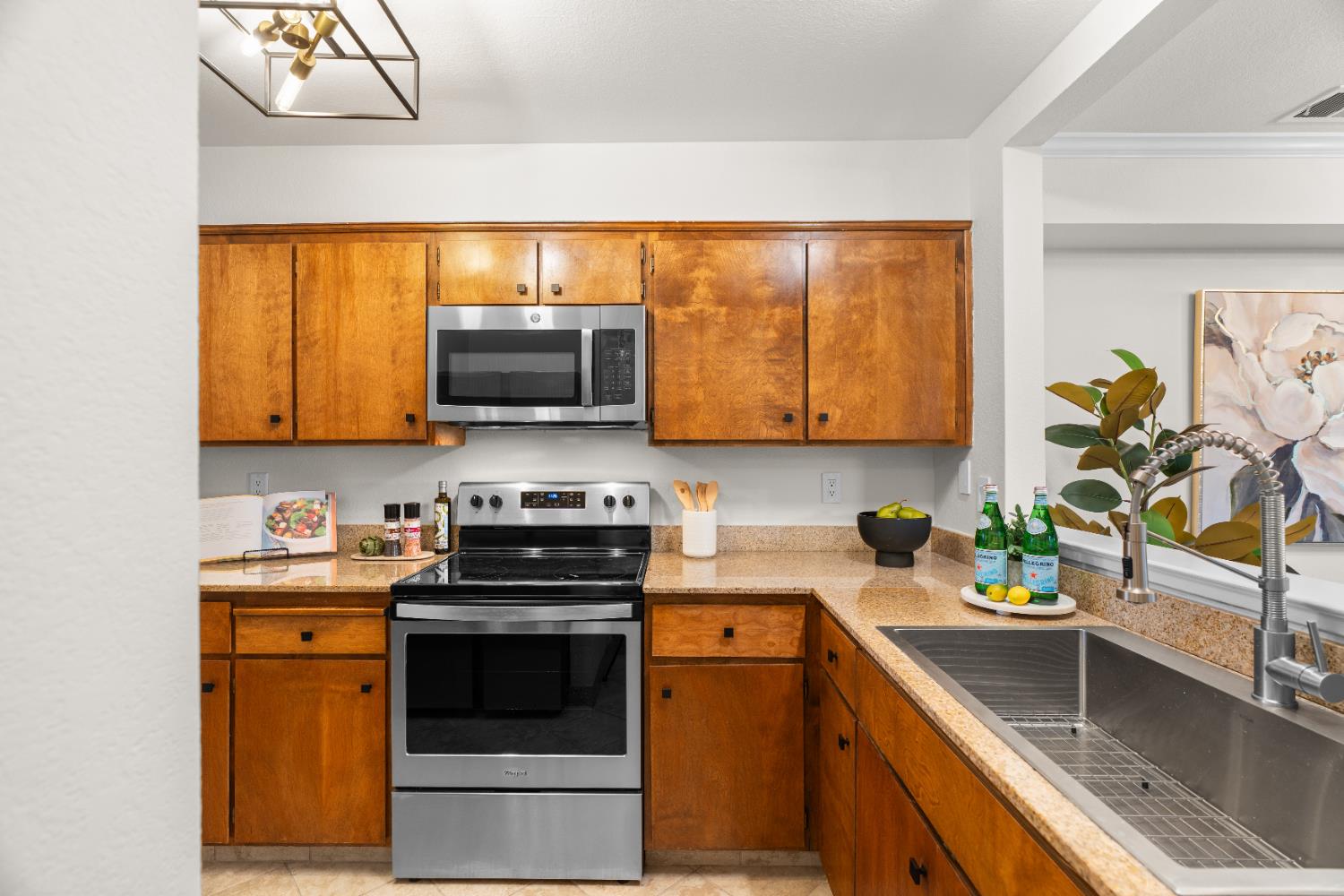 2401 Eilers Lane, Unit 105 Lodi, CA 95242 - Photo 7 of 23 a kitchen with stainless steel appliances a stove microwave and sink