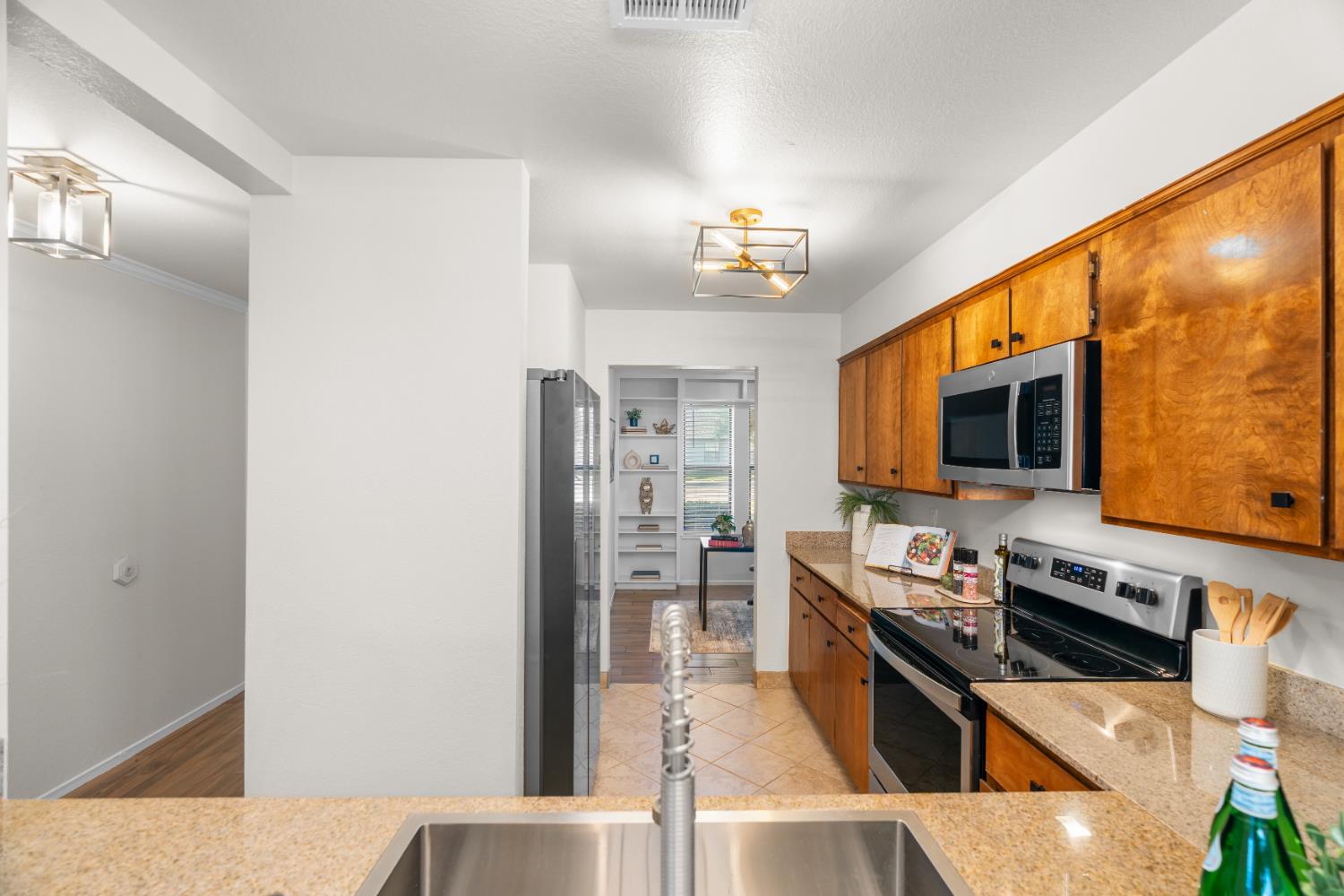 2401 Eilers Lane, Unit 105 Lodi, CA 95242 - Photo 8 of 23 a kitchen with stainless steel appliances a stove a refrigerator and cabinets