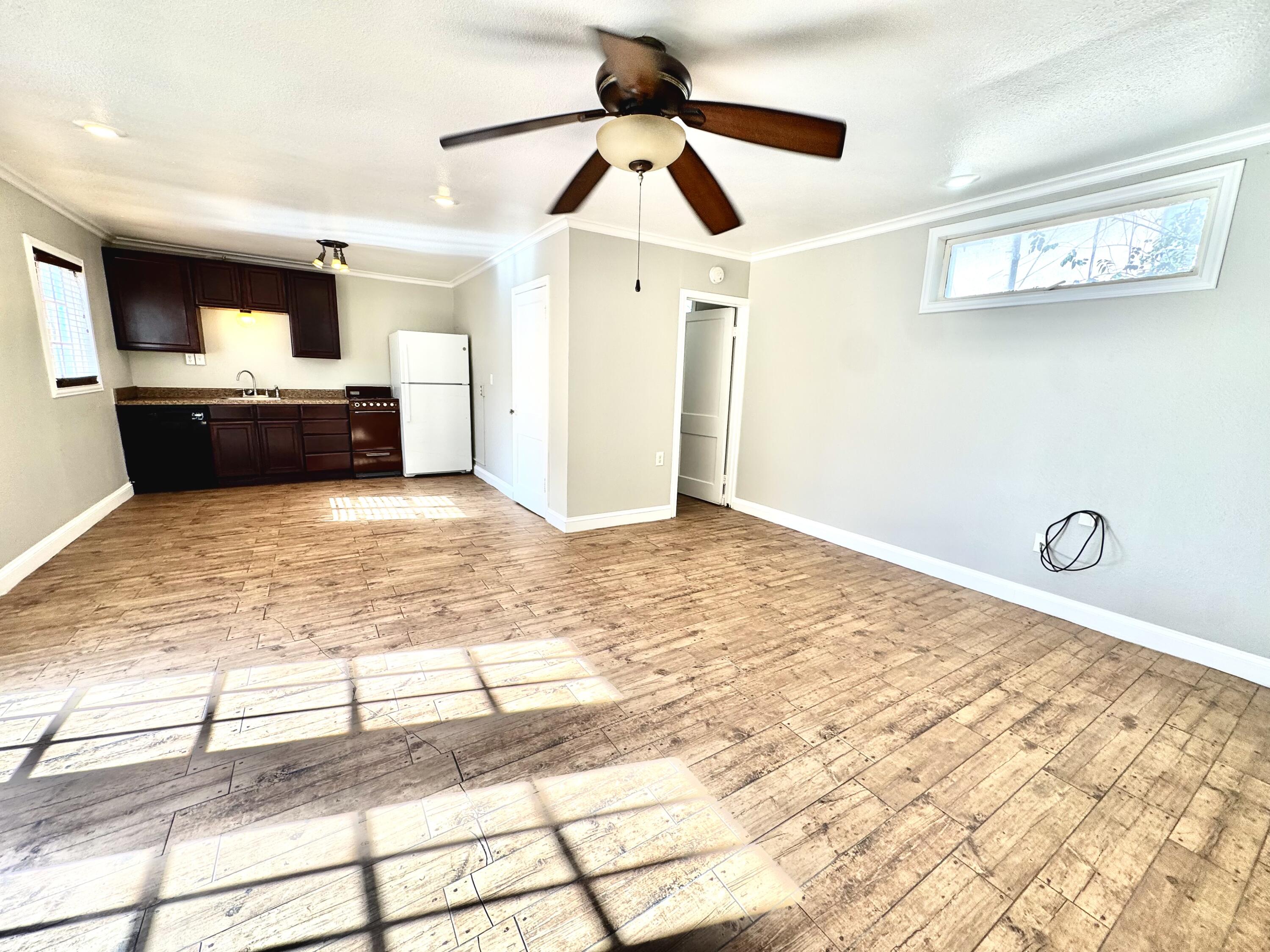 2702 23rd Street, Unit B Lubbock, TX 79410 - Photo 7 of 9 a view of a livingroom with a kitchen