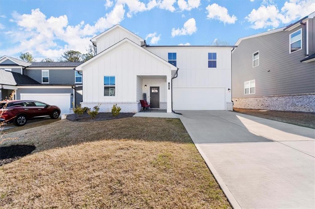 29 Dew Drop Pointe Dallas, GA 30157 - Photo 2 of 41 a view of a white house with a yard