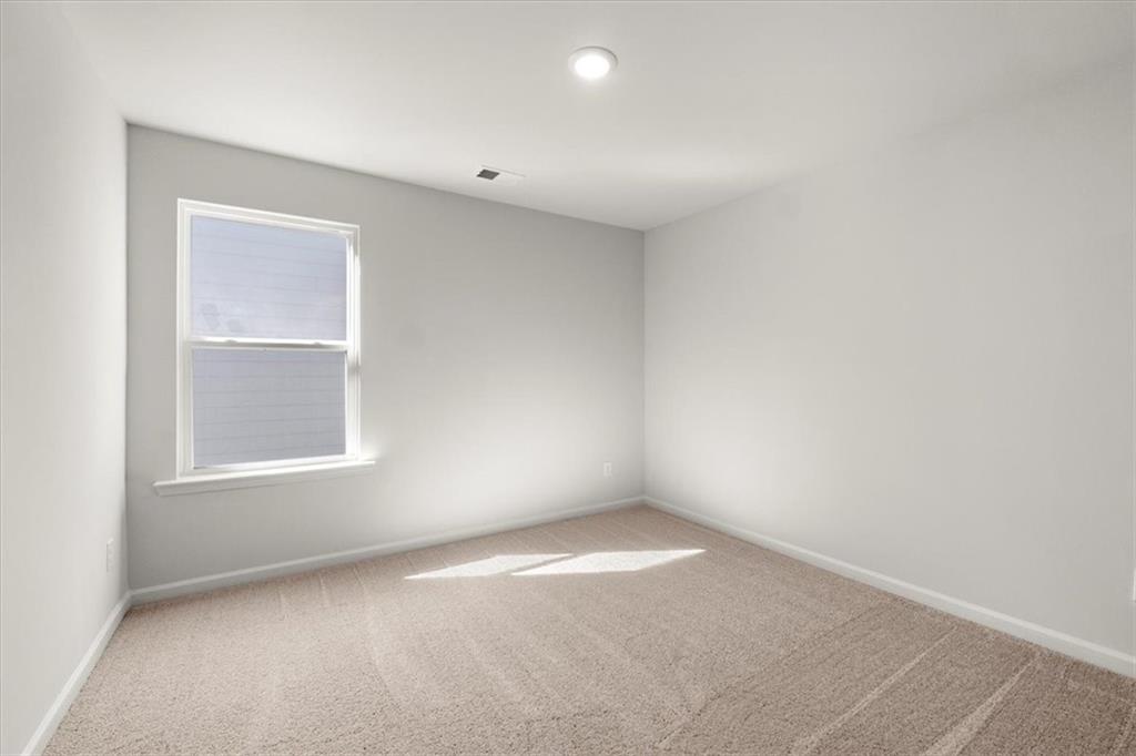 29 Dew Drop Pointe Dallas, GA 30157 - Photo 29 of 41 an empty room with a window