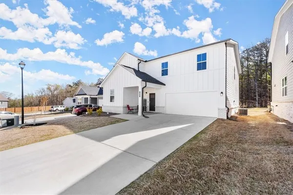 a view of a house with a road
