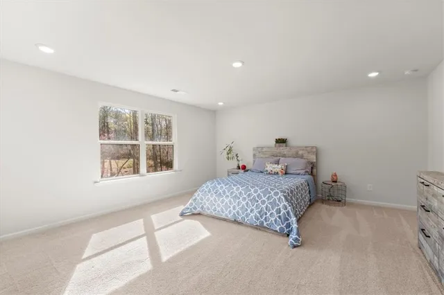 a bedroom with a bed and a cabinets