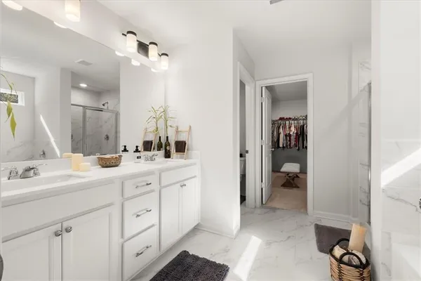 a bathroom with a bathtub and a shower