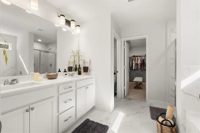 a bathroom with a bathtub and a shower