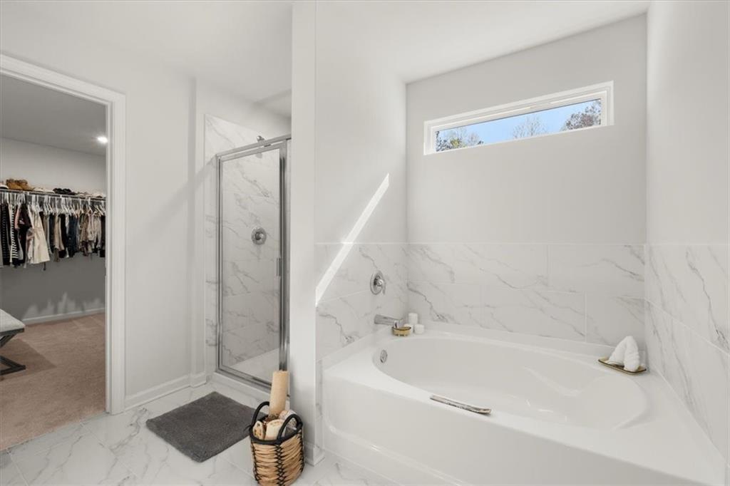 29 Dew Drop Pointe Dallas, GA 30157 - Photo 35 of 41 a bathroom with a bathtub and a shower