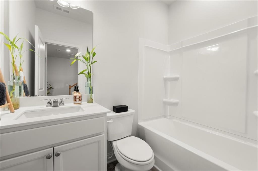 29 Dew Drop Pointe Dallas, GA 30157 - Photo 36 of 41 a bathroom with a sink a toilet and bathtub