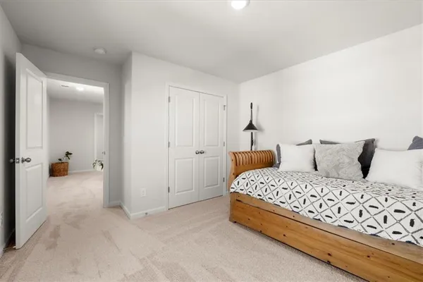 a view of walk in closet with clothes