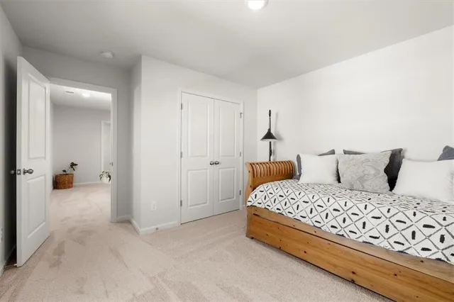 a view of walk in closet with clothes