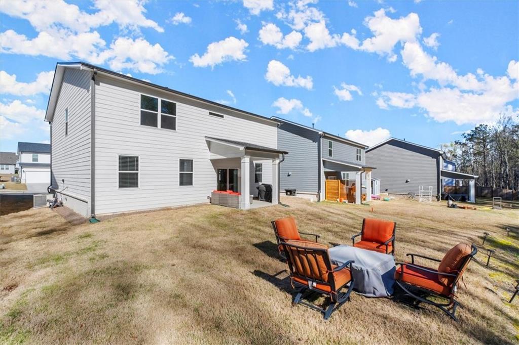 29 Dew Drop Pointe Dallas, GA 30157 - Photo 7 of 41 a view of a house with backyard and sitting area