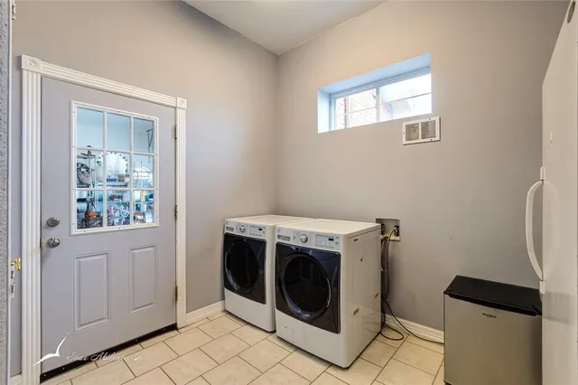 a bedroom with a bed and a television in it