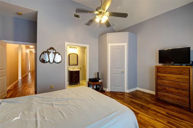 a bathroom with a sink a shower and a mirror