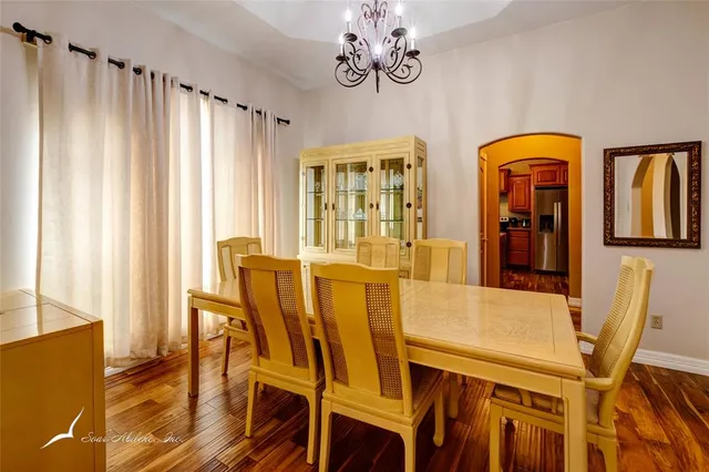 a view of a dining room with furniture and window