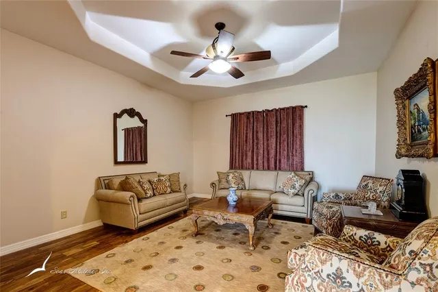 a living room with furniture and a rug