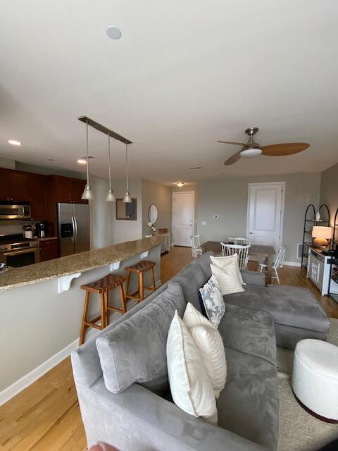 50 North Plum Grove Road, Unit 405 Palatine, IL 60067 - Photo 5 of 14 a living room with furniture and a wooden floor