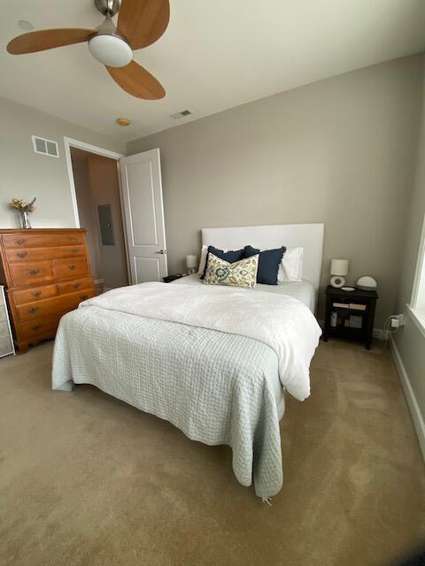 50 North Plum Grove Road, Unit 405 Palatine, IL 60067 - Photo 9 of 14 a bedroom with a bed and flowerpot