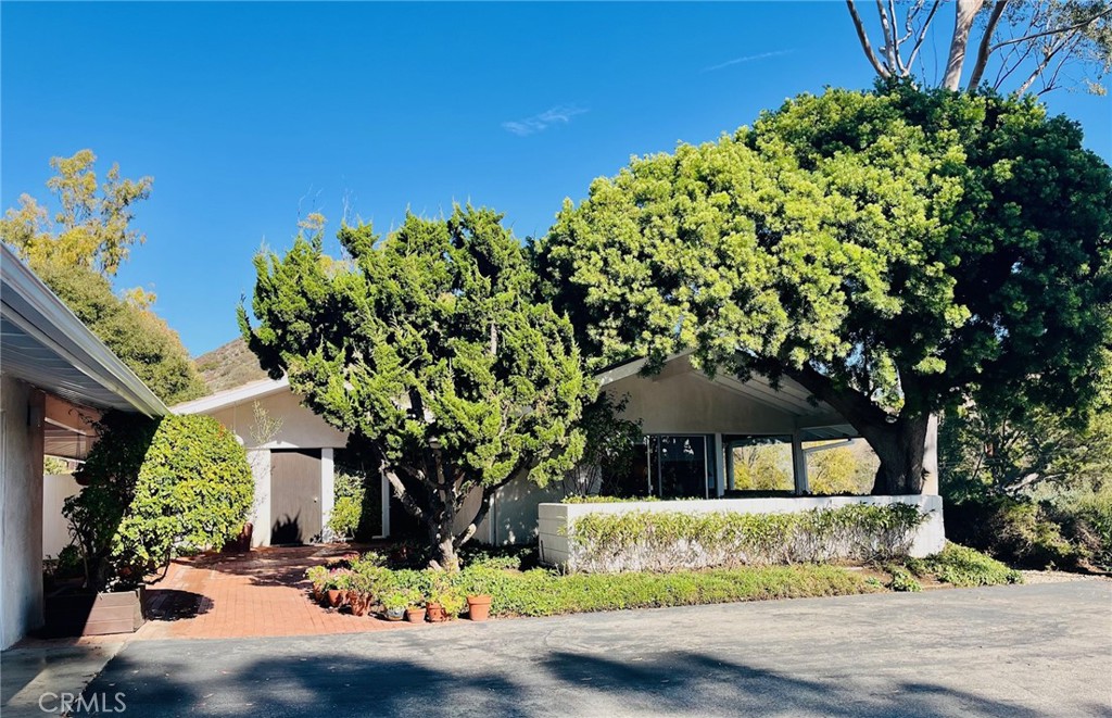 6349 Sycamore Meadows Drive Malibu, CA 90265 - Photo 1 of 10 a front view of a house with a yard