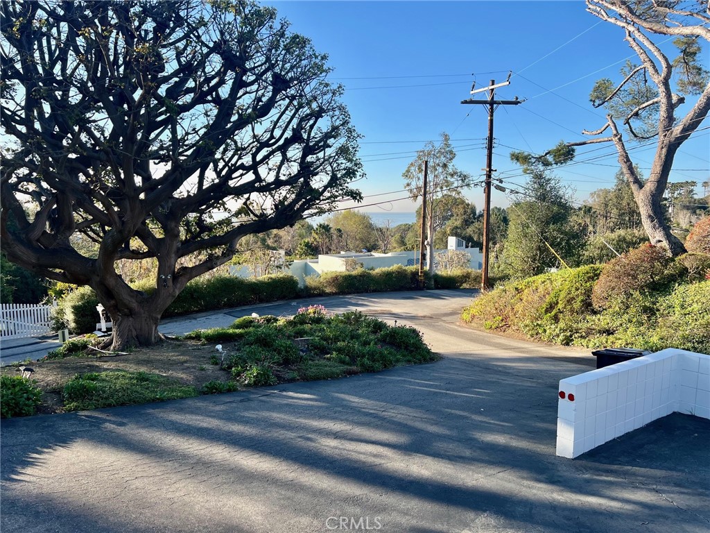 6349 Sycamore Meadows Drive Malibu, CA 90265 - Photo 2 of 10 a front view of a house with garden