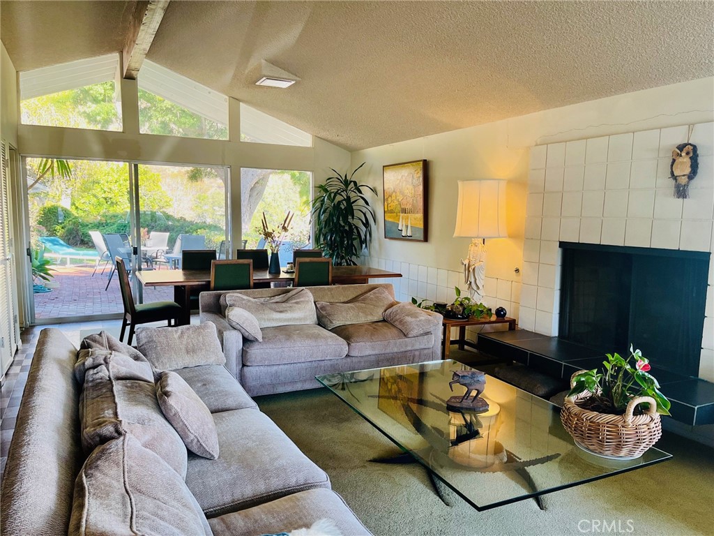6349 Sycamore Meadows Drive Malibu, CA 90265 - Photo 3 of 10 a living room with fireplace furniture and a large window