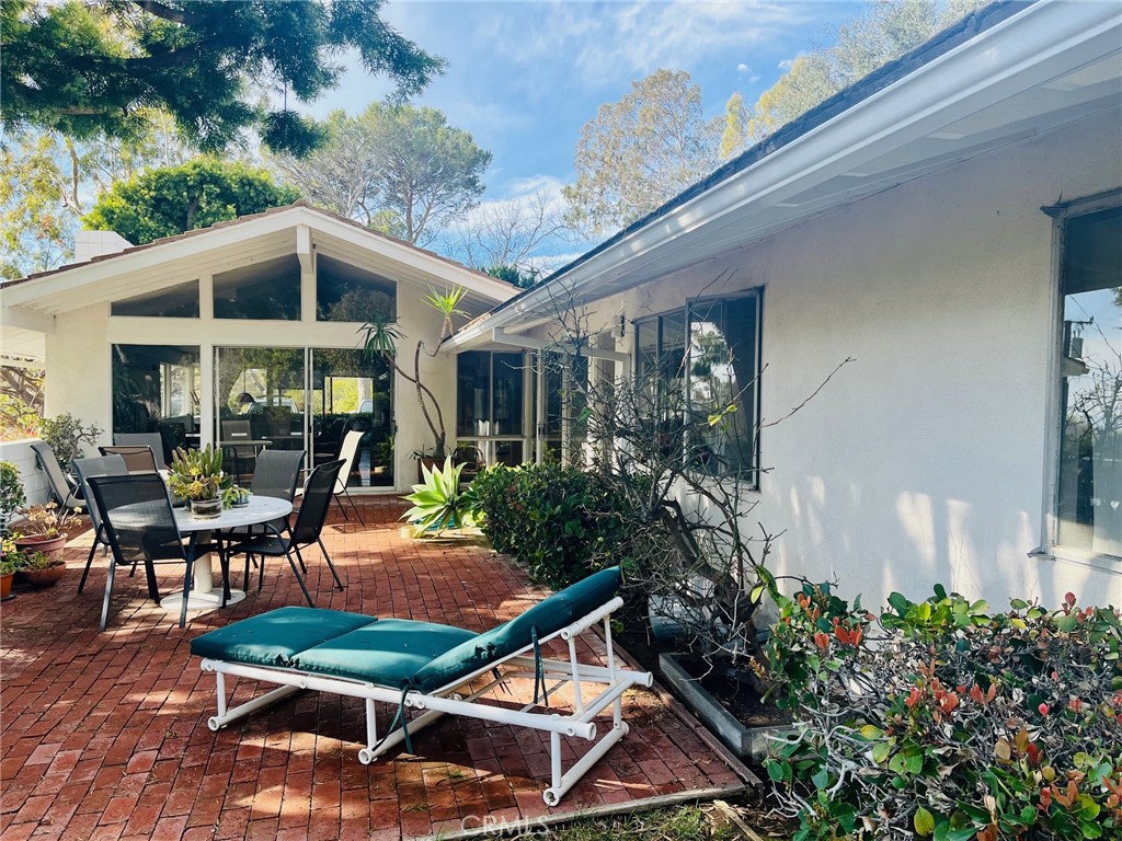 6349 Sycamore Meadows Drive Malibu, CA 90265 - Photo 5 of 10 a backyard of a house with yard barbeque oven and outdoor seating