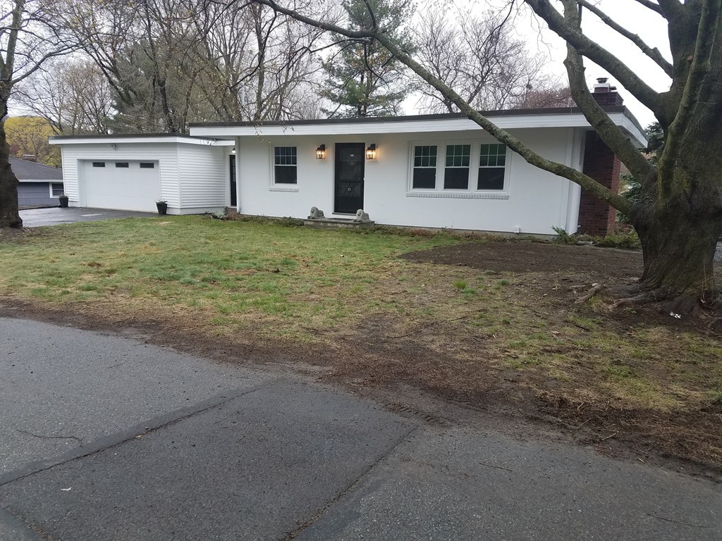 23 Lohnes Road Framingham, MA 01701 - Photo 1 of 26 a house with a tree in front of it
