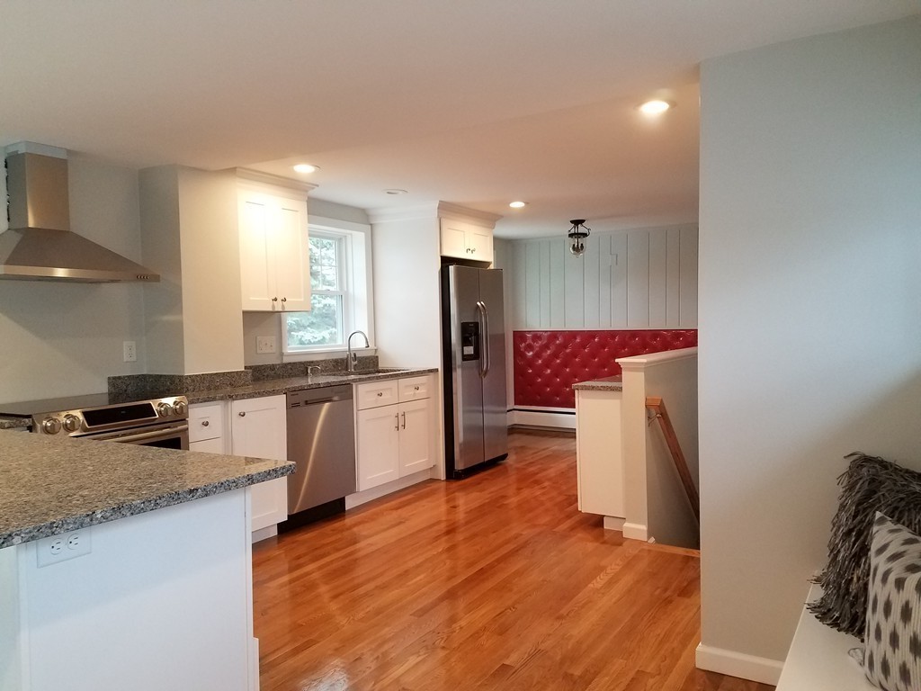 23 Lohnes Road Framingham, MA 01701 - Photo 3 of 26 a kitchen with stainless steel appliances granite countertop a refrigerator and a sink