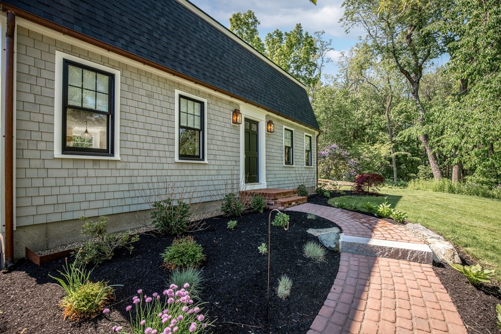 1 True Road Salisbury, MA 01952 - Photo 11 of 41 a front view of a house with garden