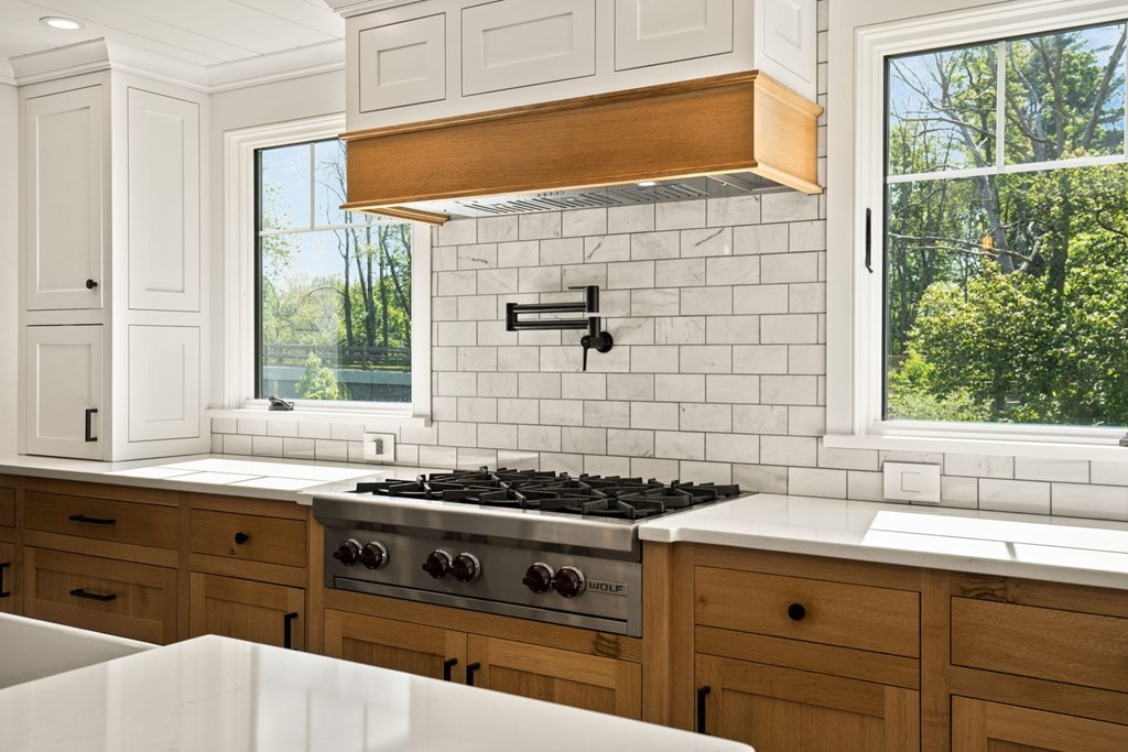 1 True Road Salisbury, MA 01952 - Photo 17 of 41 a kitchen with a sink a stove cabinets and a window