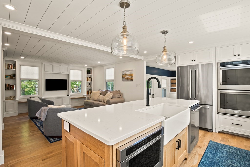 1 True Road Salisbury, MA 01952 - Photo 22 of 41 a view of living room kitchen with stove and furniture