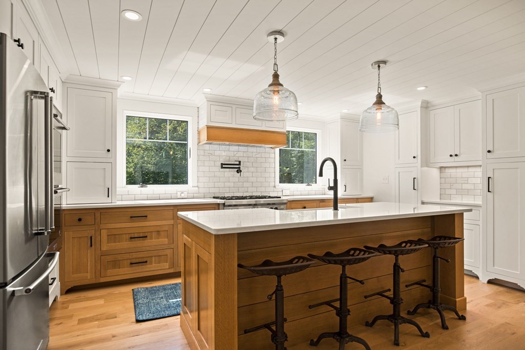 1 True Road Salisbury, MA 01952 - Photo 23 of 41 a kitchen with a sink stove and cabinets