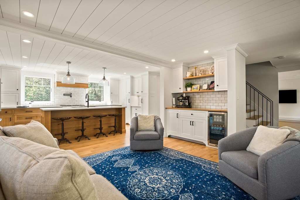 1 True Road Salisbury, MA 01952 - Photo 25 of 41 a living room with furniture and kitchen view