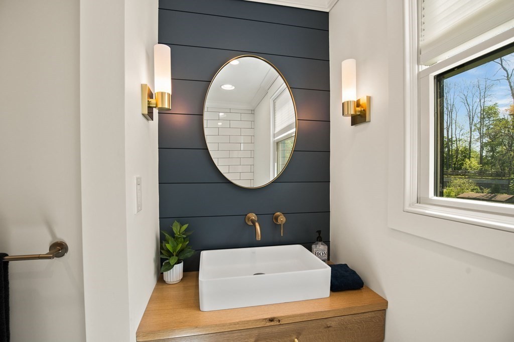 1 True Road Salisbury, MA 01952 - Photo 34 of 41 a bathroom with a sink and a mirror