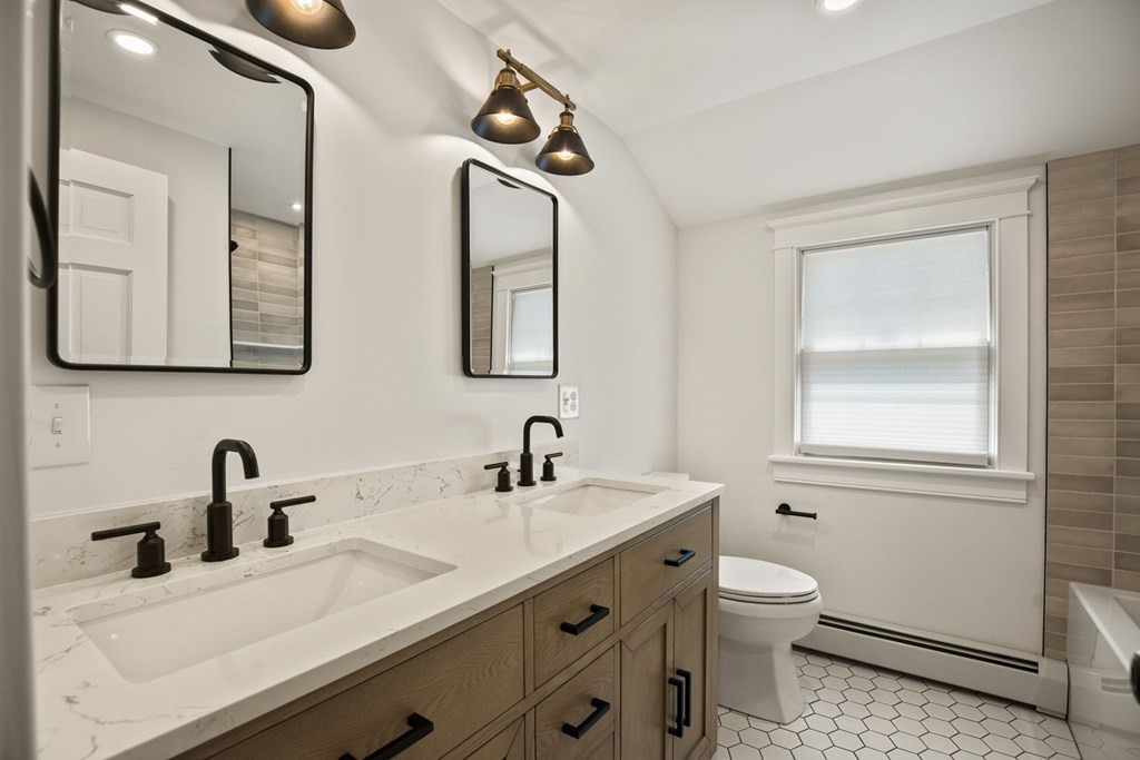 1 True Road Salisbury, MA 01952 - Photo 36 of 41 a bathroom with a sink a toilet and mirror