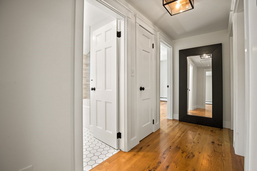 1 True Road Salisbury, MA 01952 - Photo 39 of 41 a view of a hallway with wooden floor and closet