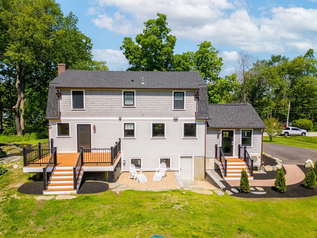 1 True Road Salisbury, MA 01952 - Photo 5 of 41 a view of a house with backyard porch and sitting area