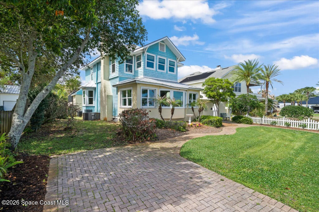 1110 Riverside Drive Titusville, FL 32780 - Photo 2 of 50 front view of a house with a yard