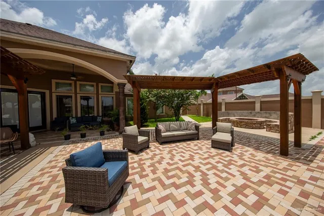 a view of a patio with couches and potted plants