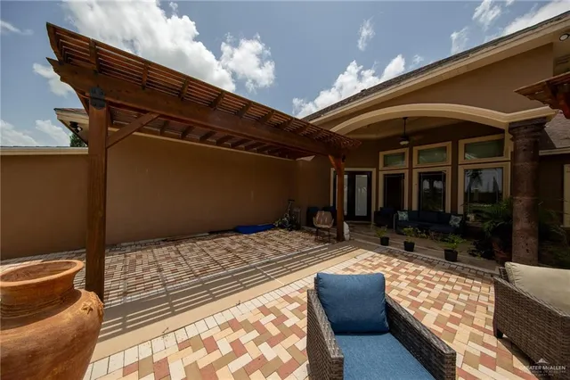 a view of a swimming pool with a patio