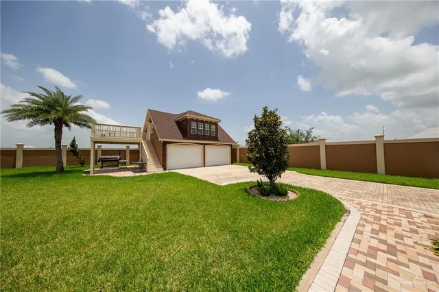a view of a backyard with potted plants