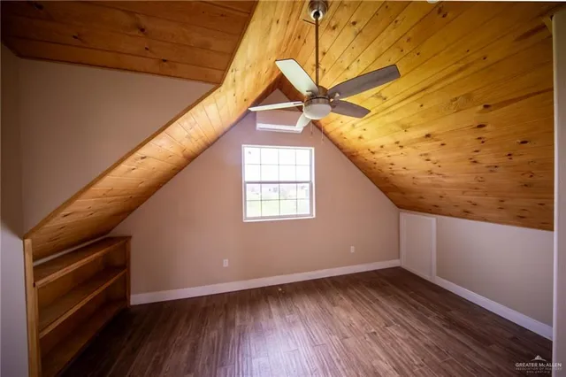 a view of balcony with wooden floor and fence
