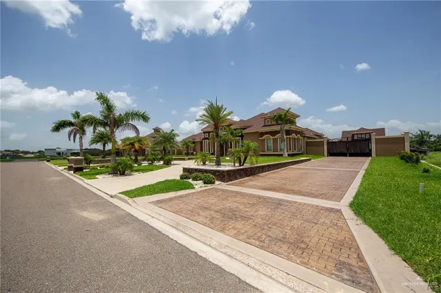 a living room with furniture a chandelier and a large window